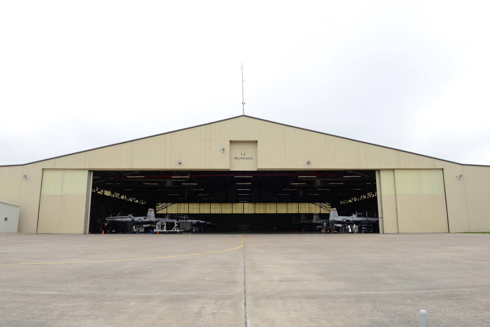 Laughlin’s T-6 maintenance hangar opens its doors on Laughlin Air Force Base, Texas, April 12, 2017. Laughlin’s T-6 maintainers have restored nearly all 38 of the T-6 hangar queens on base, putting Laughlin at the top of Air Education and Training Command with the least amount of T-6 hangar queens. A “hangar queen” is an aircraft that hasn’t been flown in more than 30 days. (U.S. Air Force photo/Airman 1st Class Benjamin N. Valmoja)
