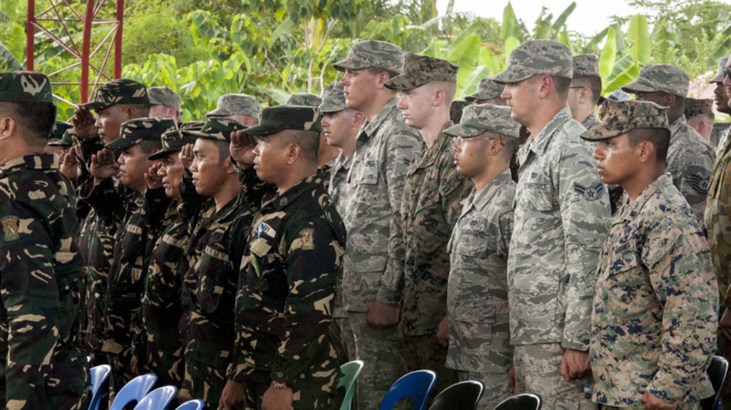 Philippine Soldiers and U.S. military engineers stand for the Philippine national anthem during a groundbreaking ceremony for Balikatan 2017 in Ormoc City, Leyte. Leaders from the Armed Forces of the Philippines, U.S. military, and Ormoc City gathered to commemorate the beginning of engineering projects for new classrooms at Margen Elementary School in Ormoc City, April 25, 2017. Balikatan is an annual U.S.-Philippine military bilateral exercise focused on a variety of missions, including humanitarian assistance and disaster relief and counterterrorism. 