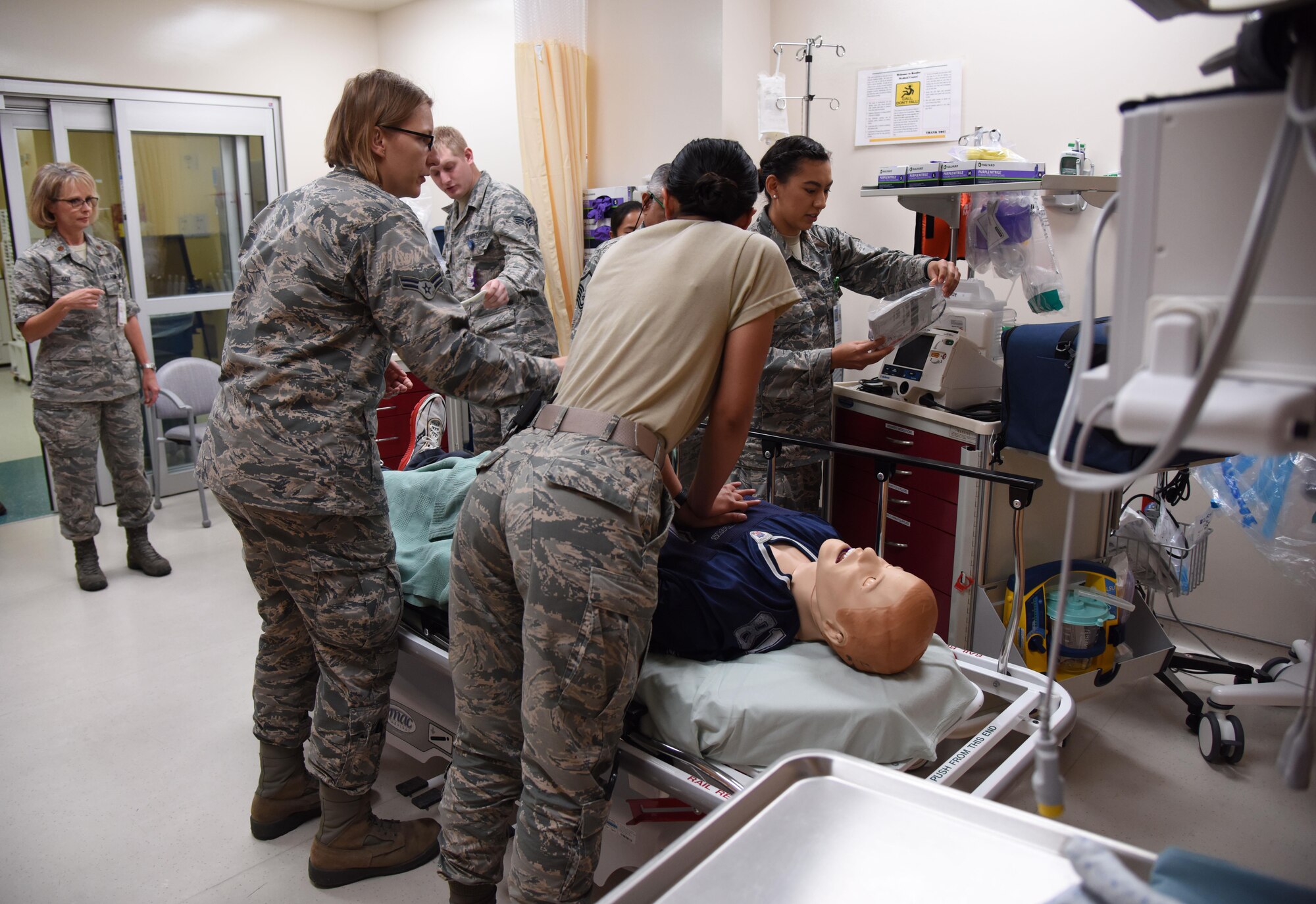 Members of the 81st Medical Operations Squadron participate in a medical emergency scenario during Code Blue Thursday in the Keesler Medical Center emergency room April 27, 2017, on Keesler Air Force Base, Miss. Emergency room staff members coordinated with the simulation lab to use human patient simulators for running various advanced cardiac life support scenarios to improve Keesler’s new medical technicians’ skills and get them familiar with emergency equipment. (U.S. Air Force photo by Kemberly Groue)