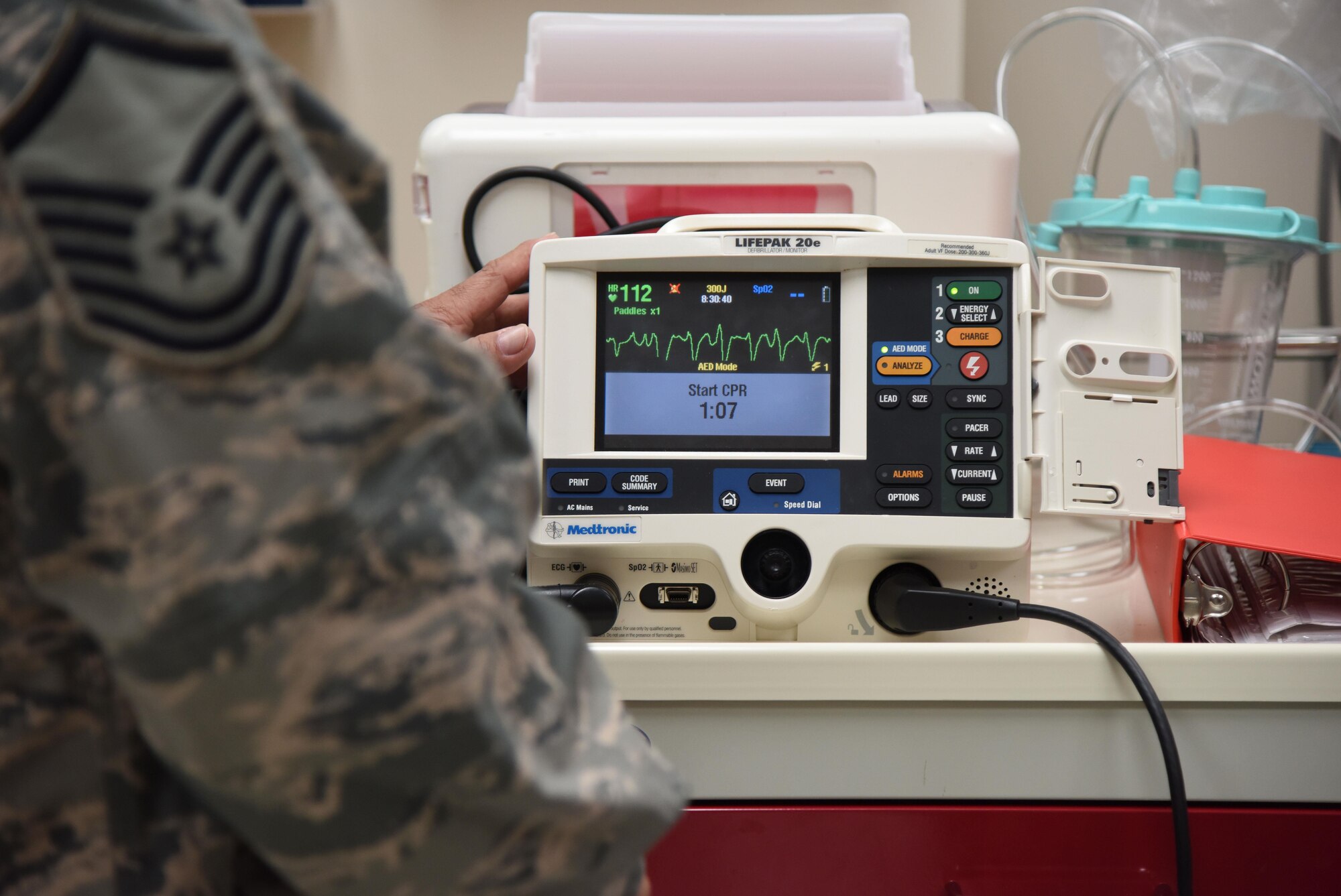 Master Sgt. Juan Diaz, 81st Medical Operations Squadron medical technician, operates a defibrillator during Code Blue Thursday in the Keesler Medical Center emergency room April 27, 2017, on Keesler Air Force Base, Miss. Emergency room staff members coordinated with the simulation lab to use human patient simulators for running various advanced cardiac life support scenarios to improve Keesler’s new medical technicians’ skills and get them familiar with emergency equipment. (U.S. Air Force photo by Kemberly Groue)