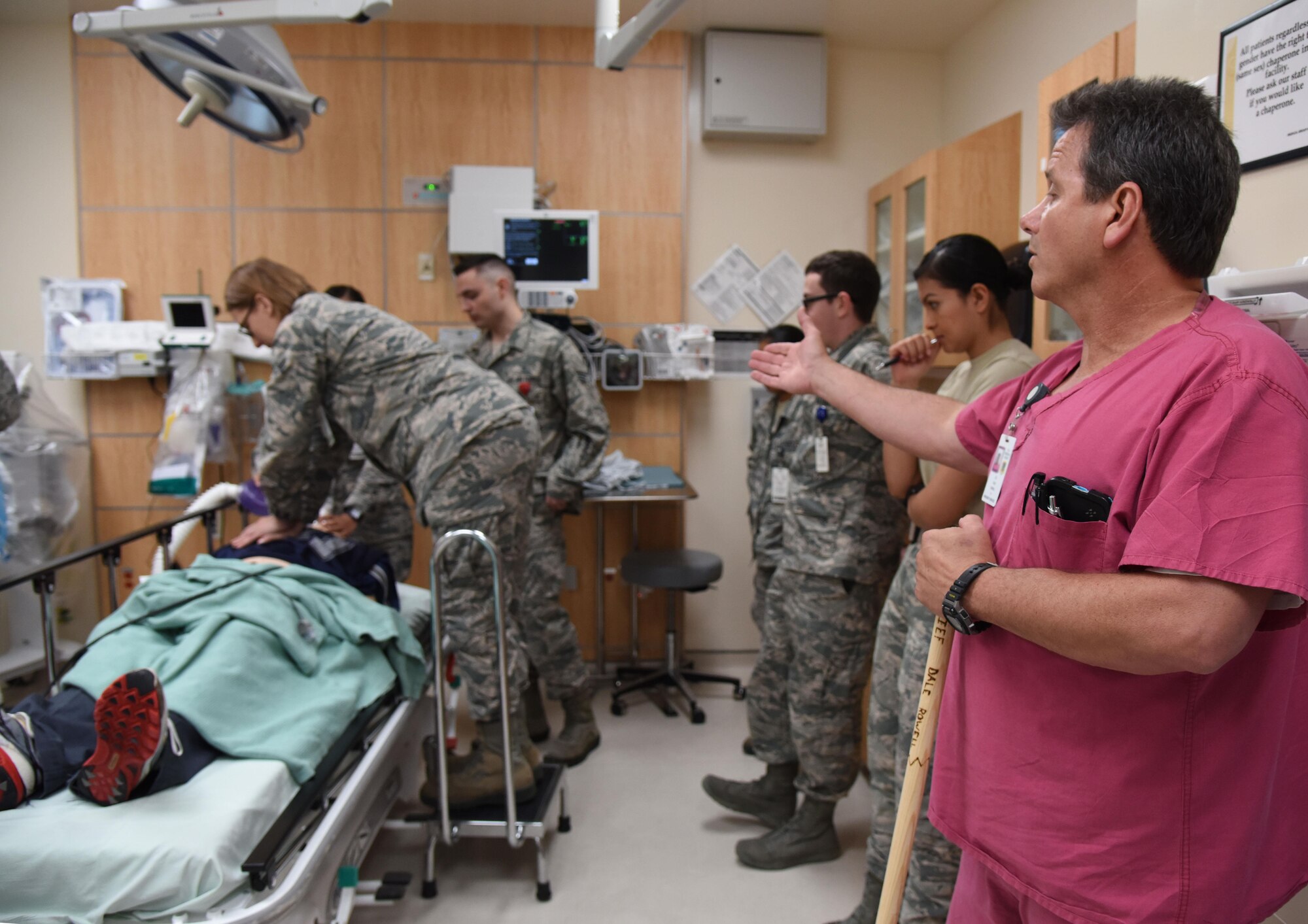 Dale Rowell, 81st Medical Operations Squadron charge nurse, instructs staff members as they participate in a medical emergency scenario during Code Blue Thursday in the Keesler Medical Center emergency room April 27, 2017, on Keesler Air Force Base, Miss. Emergency room staff members coordinated with the simulation lab to use human patient simulators for running various advanced cardiac life support scenarios to improve Keesler’s new medical technicians’ skills and get them familiar with emergency equipment. (U.S. Air Force photo by Kemberly Groue)