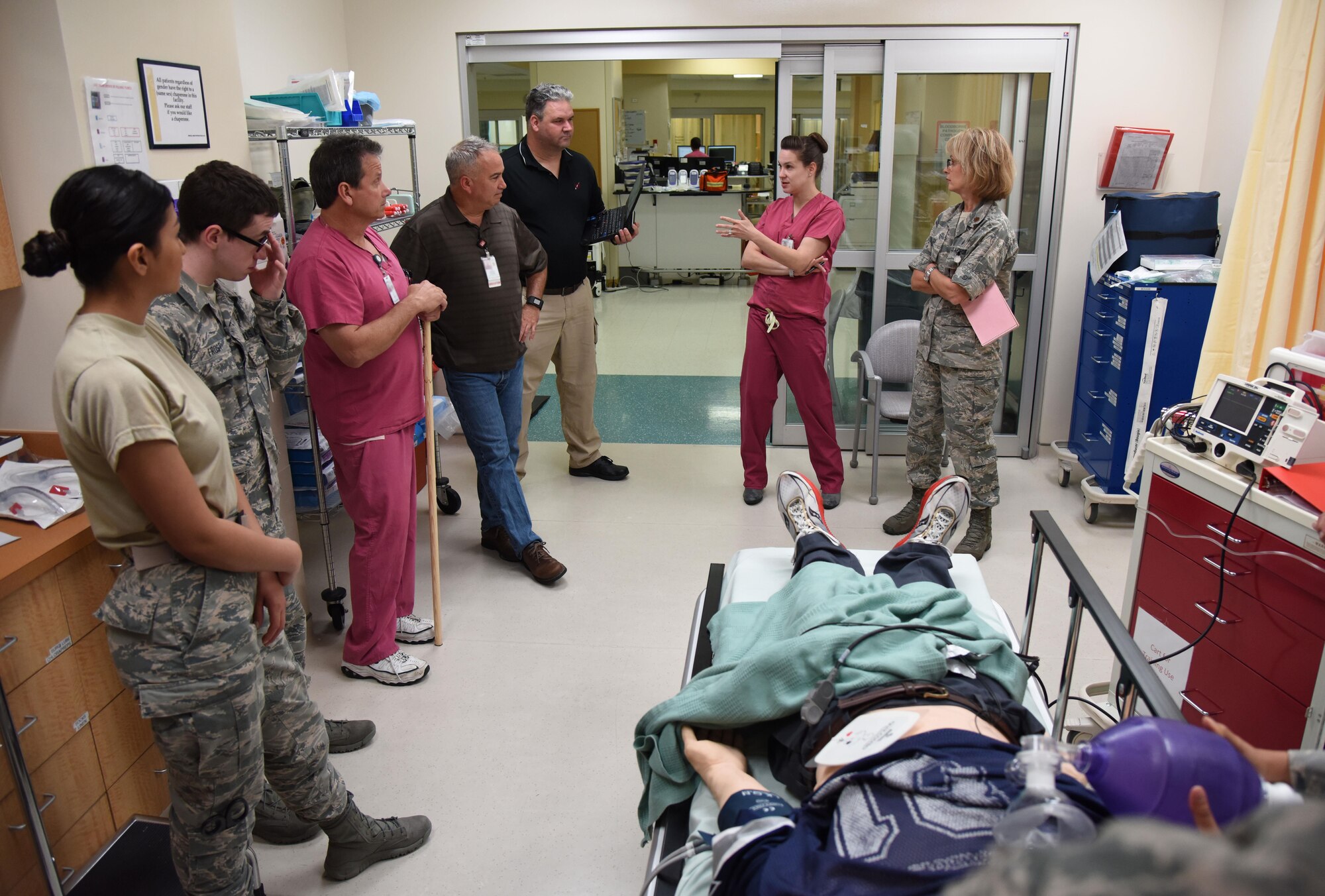 Members of the 81st Medical Operations Squadron participate in a “hot wash” following a medical emergency training scenario during Code Blue Thursday in the Keesler Medical Center emergency room April 27, 2017, on Keesler Air Force Base, Miss. Emergency Room staff members coordinated with the simulation lab to use human patient simulators for running various advanced cardiac life support scenarios to improve Keesler’s new medical technicians’ skills and get them familiar with emergency equipment. (U.S. Air Force photo by Kemberly Groue)
