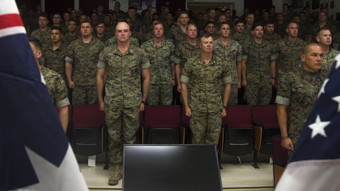 Marines with Tactical Training Exercise Control Group stand at attention during an Australian and New Zealand Army Corps (ANZAC) Day celebration aboard Marine Corps Air Ground Combat Center, Twentynine Palms, Calif., April 25, 2017. ANZAC Day recognizes the anniversary of the landing of Australian and New Zealand forces during the Battle of Gallipoli in World War I. (U.S. Marine Corps photo by Sgt. Connor Hancock)