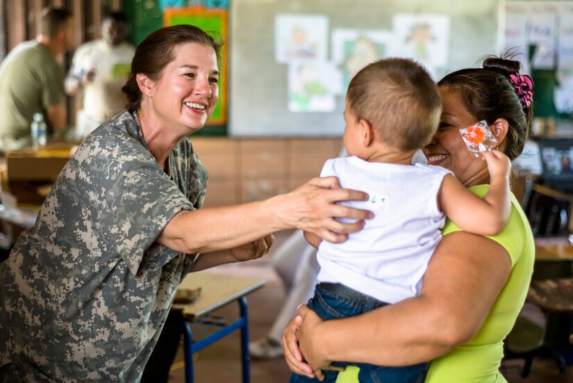 U.S. Army Lt. Col. Rhonda Dyer provides deworming and preventative medication to Hondurans at a Medical Readiness Training Exercise site at Cooperativa village, Colon, Honduras , Apr. 20, 2017. Joint Task Force – Bravo Medical Element, provided care to more than 850 patients during a Medical Readiness Training Exercise in Cooperativa village, Colon, Honduras, Apr. 20-21, 2017. MEDEL also supported a Military Partnership Engagement and assisted more than 650 patients with the Hondurian Navy in Santa Rosa de Aguan, Colon, Honduras, Apr. 22, 2017. (U.S. Air National Guard photo by Master Sgt. Scott Thompson/released)