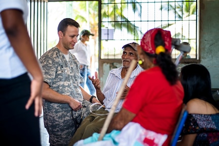 U.S. Army Capt. Adam West provides medical care to Honduran patients at a Medical Readiness Training Exercise site at Cooperativa village, Colon, Honduras , Apr. 21, 2017. Joint Task Force – Bravo Medical Element, provided care to more than 850 patients during a Medical Readiness Training Exercise in Cooperativa village, Colon, Honduras, Apr. 20-21, 2017. MEDEL also supported a Military Partnership Engagement and assisted more than 650 patients with the Hondurian Navy in Santa Rosa de Aguan, Colon, Honduras, Apr. 22, 2017. (U.S. Air National Guard photo by Master Sgt. Scott Thompson/released)