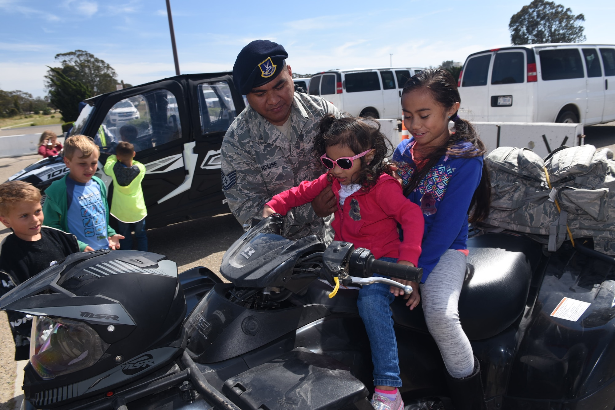 Tech. Sgt. Benjamin Kolise, 30th Security Forces Squadron standards and evaluation, takes his daughters, Terineise and Fiasili, to work during Take Your Child to Work day, April 27, 2017, Vandenberg Air Force Base, Calif. Take Your Child to Work Day gives military youth an opportunity to see what their parents contribute to the space and missile mission. (U.S. Air Force photo by Tech. Sgt. Jim Araos/Released)