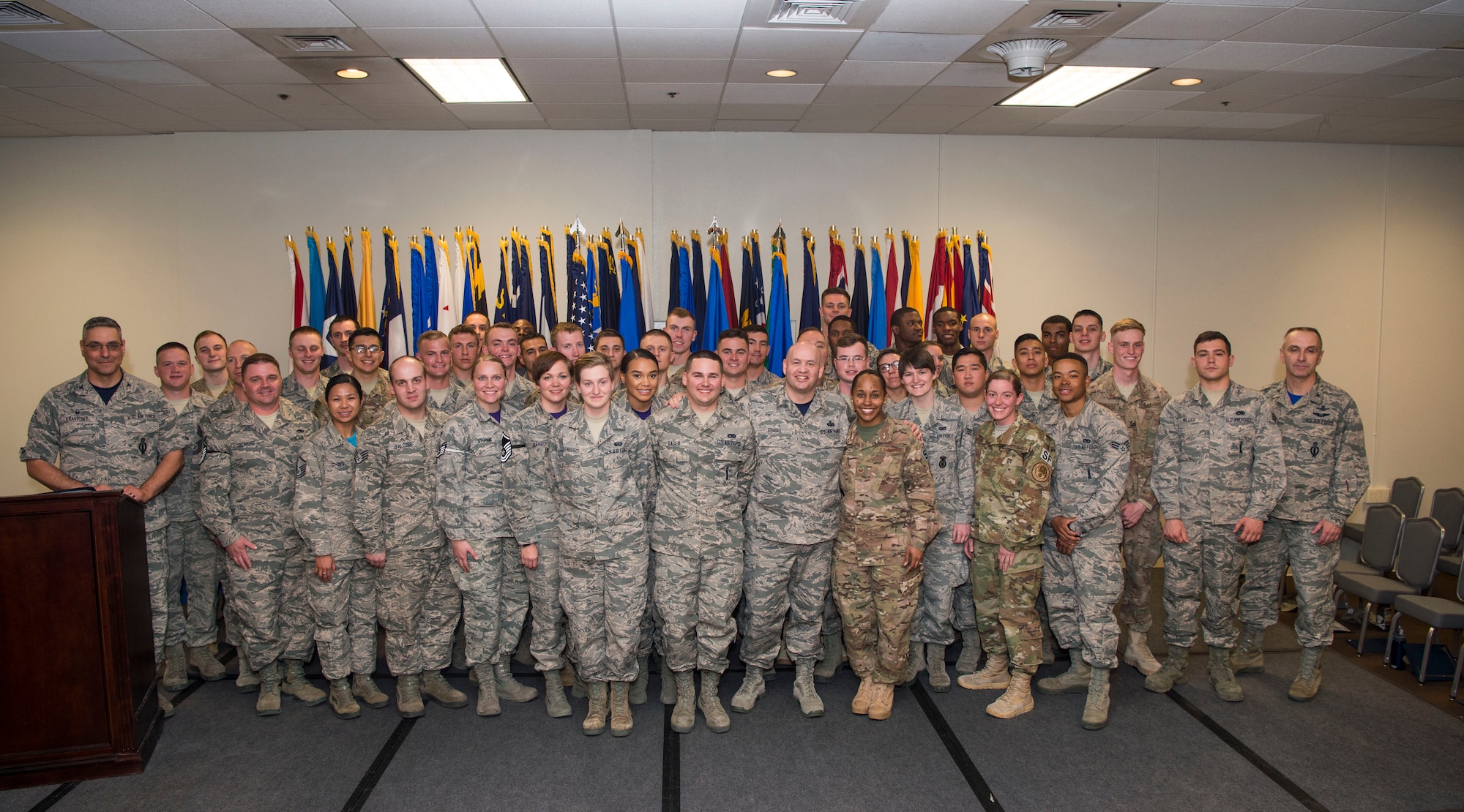 Col. Stephen Kravitsky, 90th Missile Wing commander along with Col. Lloyd Buzzell, 20th Air Force vice commander and Chief Master Sgt. Jeffery Steagall, 90th MW command chief pose for a group photo with enlisted Airmen who promoted in March and April during the wing promotion ceremony on F.E. Warren Air Force Base, Wyo., April 28, 2017. Each month the Mighty Ninety hosts a ceremony to recognize the promotees from the base. (U.S. Air Force photo by Staff Sgt. Christopher Ruano)