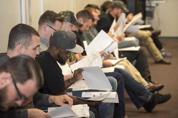 Members of the Individual Ready Reserve attending an annual IRR muster look through paperwork at Beale Air Force Base, Calif. April 8, 2017. During the muster, IRR members updated their contact and medical information, as well as receive briefings on member responsibilities and opportunities available to them. (U.S. Air Force photo by Staff Sgt. Brenda Davis)