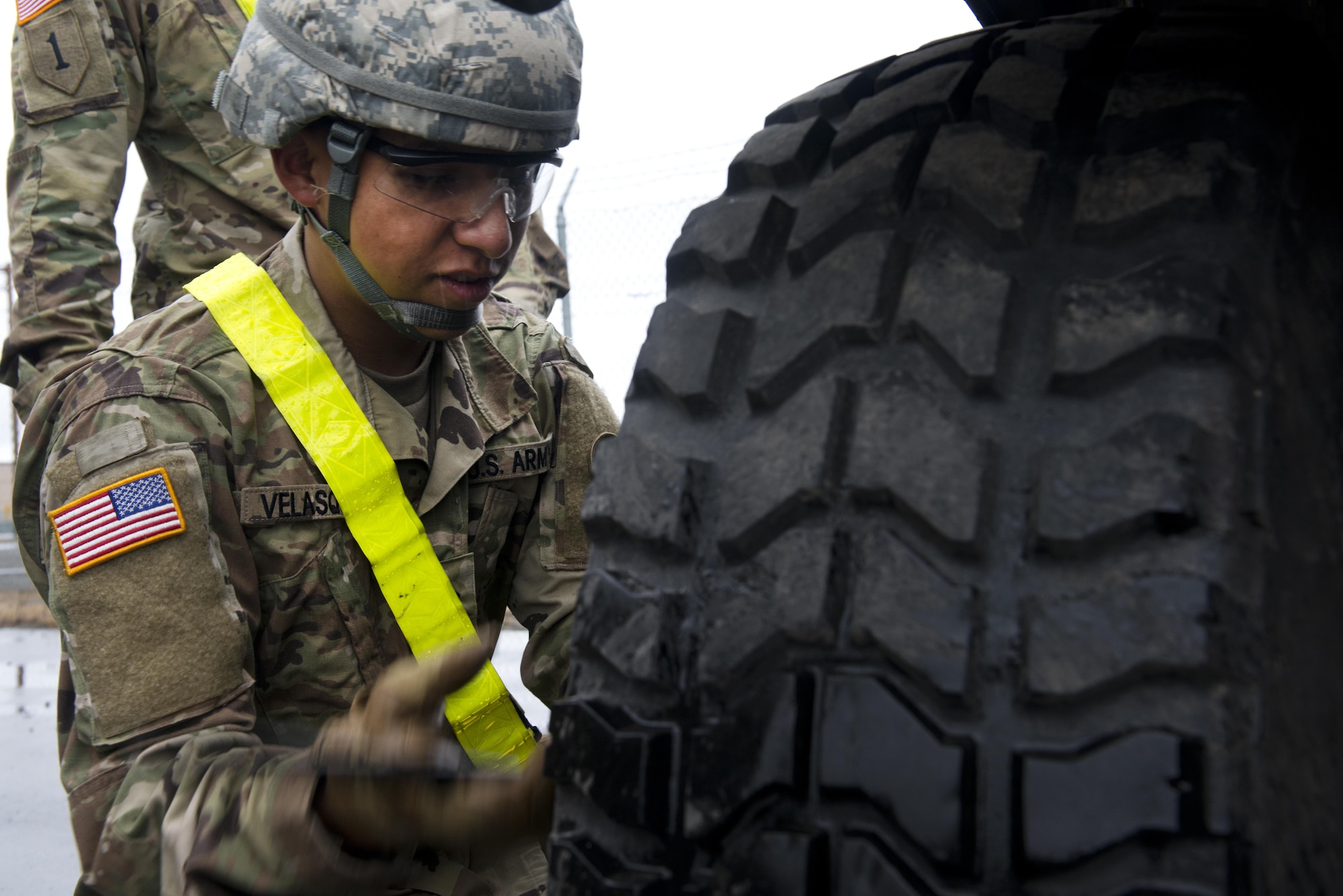 Private Second Class Anthony Velasquez, assigned to the 98th Maintenance Company, 17th Combat Sustainment Support Battalion changes the tire on a humvee as he competes in the 98th MC's maintenance rodeo April 27. The Rodeo is designed to sharpen their professional skill sets and their interpersonal relationships to create a stronger unit. 