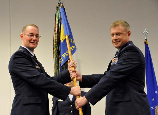 Lt. Col. Allen Duckworth (right) took command of the 97 FTS in Change of Command ceremonies at Sheppard Air Force Base, Texas, April 28. Here, Duckworth accepts the 97 FTS guidon from Col. Roger Suro, Commander of the 340th Flying Training Group, Joint Base San Antonio-Randolph-Texas. These ceremonies represent the formal passing of responsibility, authority and accountability of command from one officer to another (U.S. Air Force photo