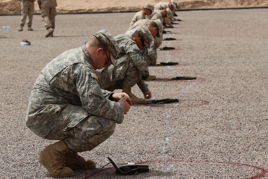 U.S. Soldiers representing the 805th Military Police Company and Alpha 3rd Marine Fleet Antiterrorism Security Team (FAST), complete 9 millimeter weapons training with Royal Moroccan Armed Forces during Exercise African Lion April 22, at Tifnit, Morocco. By training together, the U.S. military and Moroccan Army will further develop tactics, techniques, and procedures that enhance interoperability between the two militaries.