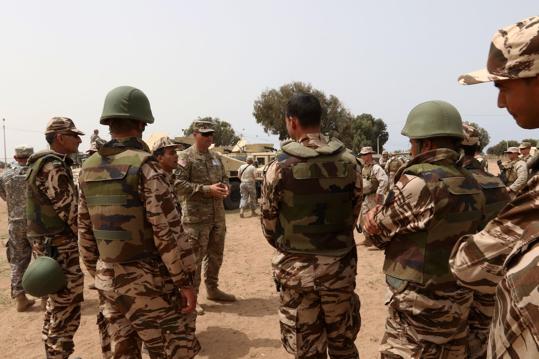 Army Sgt. Bradley Byrd, a military policeman with the 805th Military Police Company in Cary, North Carolina, explains convoy tactics to the Royal Moroccan Armed Forces in TIfnit, Morocco, on April 22, 2017, during Exercise African Lion. Exercise African Lion is an annually scheduled, combined multilateral exercise designed to improve interoperability and mutual understanding of each nation’s tactics, techniques and procedures.