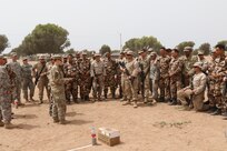 U.S. Army Sgt. Amanda Such, a military policeman with the 805th Military Police Company in Cary, North Carolina, teaches a class on vehicle control points to soldiers, Marines and Royal Moroccan Armed Forces in TIfnit, Morocco, on April 22, 2017, during Exercise African Lion. Exercise African Lion is an annually scheduled, combined multilateral exercise designed to improve interoperability and mutual understanding of each nation’s tactics, techniques and procedures.