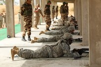 U.S. Soldiers representing the 805th Military Police Company and Alpha 3rd Marine Fleet Antiterrorism Security Team (FAST), complete weapons training with Royal Moroccan Armed Forces during Exercise African Lion April 22, at Tifnit, Morocco. By training together, the U.S. military and Moroccan Army will further develop tactics, techniques, and procedures that enhance interoperability between the two militaries.