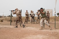 Marine Sgt. Jaimen Granados, a member of the Fleet Antiterrorism Security Team from Norfolk, Virginia, and a Royal Morocco Armed Forces soldier clear a sample room during close quarters battle training on April 23, 2017, in Tifnit, Morocco, during Exercise African Lion. Exercise African Lion is an annually scheduled, combined multilateral exercise designed to improve interoperability and mutual understanding of each nation’s tactics, techniques and procedures.