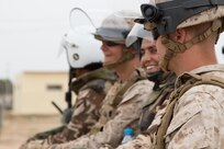 Marine Company B, 4th Law Enforcement Battalion from Pittsburg, Pennsylvania, and Royal Moroccan Armed Forces enjoy a small break in crowd control training in Tifnit, Morocco, on April 24, 2017, during Exercise African Lion. Exercise African Lion is an annually scheduled, combined multilateral exercise designed to improve interoperability and mutual understanding of each nation’s tactics, techniques and procedures.