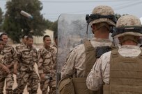 U.S. Soldiers with the 805th Military Police Company, Marines from Marine Company B, 4th Law Enforcement Battalion, and Royal Moroccan Armed Forces confront aggressive rioters in crowd control training at Tifnit, Morocco, on April 24, 2017, during Exercise African Lion. Exercise African Lion is an annually scheduled, combined multilateral exercise designed to improve interoperability and mutual understanding of each nation’s tactics, techniques and procedures.