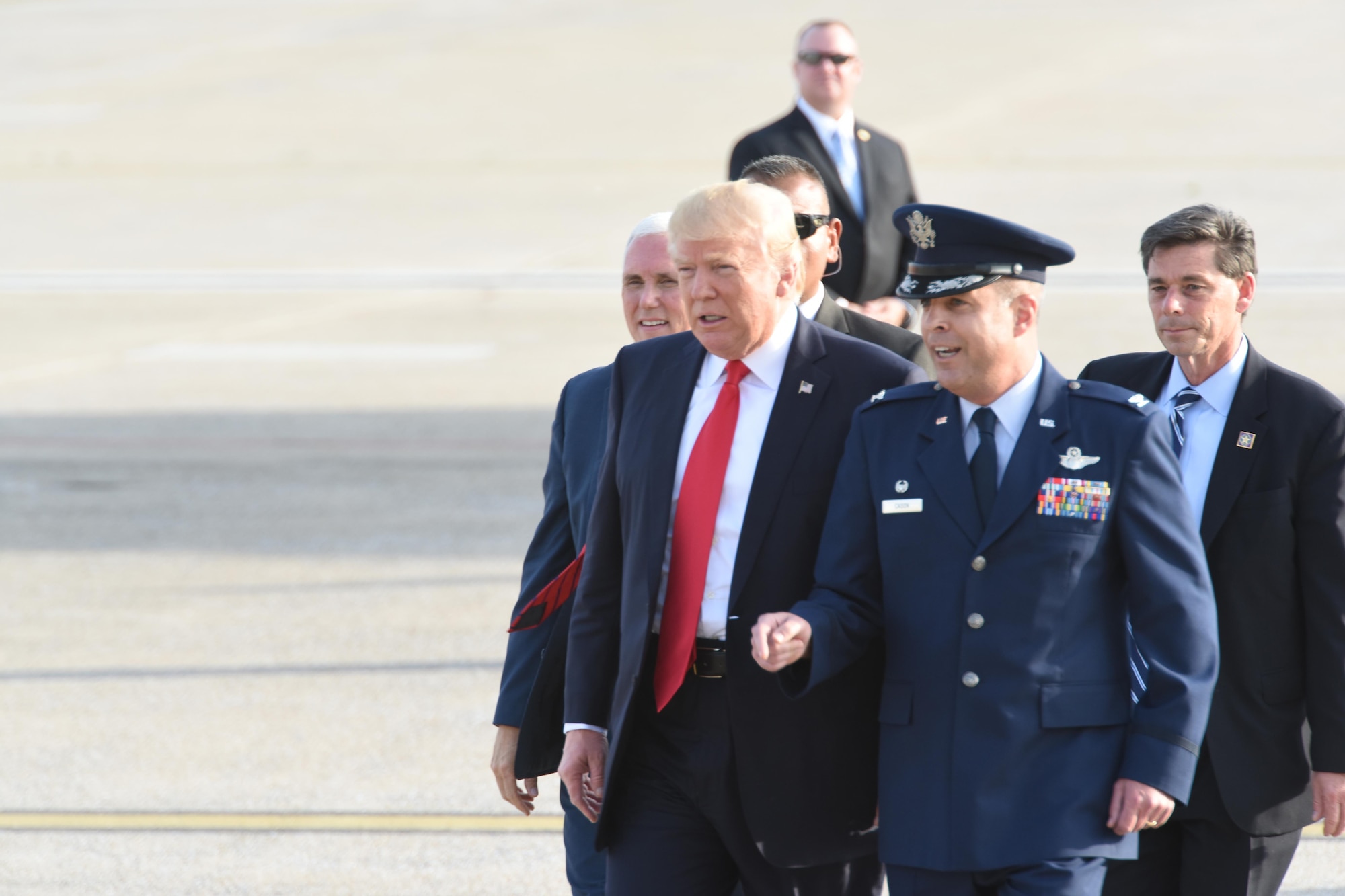 President Donald J. Trump and Vice President Mike Pence walk with 193rd Special Operation Wing Commander Benjamin “Mike” Cason over to 193rd SOW Airmen, and Airmen’s family and friends, to shake their hands, Middletown, Pennsylvania, April 29, 2017. The President and Vice President landed at the 193rd SOW and were on their way the Harrisburg Farm Show Complex for President Trump’s 100th day rally when they made time to greet those that awaited their arrival. (U.S. Air National Guard Photo by Master Sgt. Culeen Shaffer/Released)