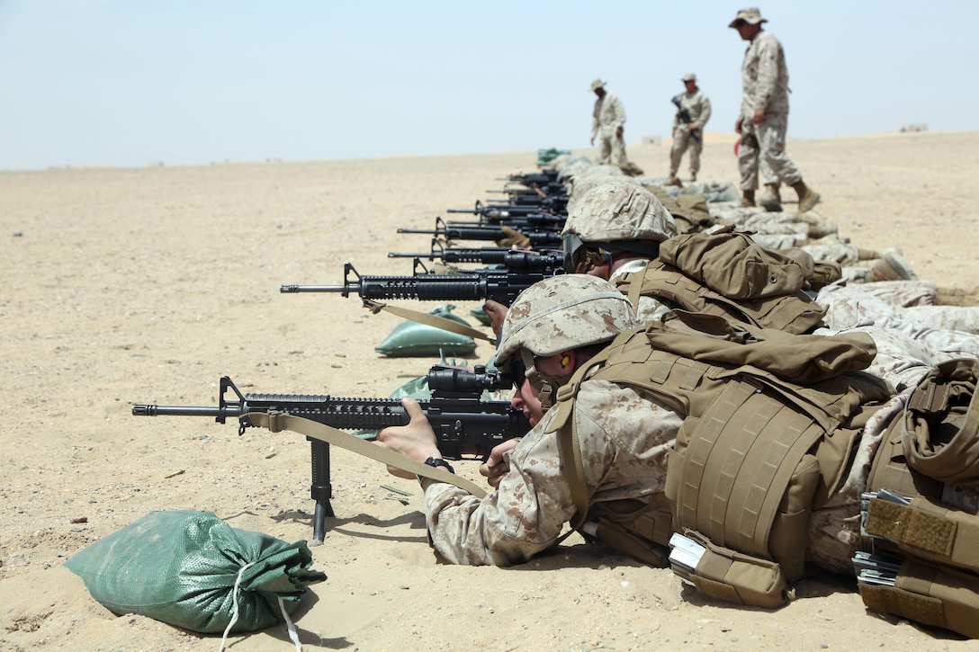 U.S. Marines with Marine Wing Support Squadron 372, Special Purpose Marine Air-Ground Task Force-Crisis Response-Central Command, and U.S. Airforce airmen with the 407th Air Expeditionary Group aim downrange during a battle sight zero range while forward deployed in the Middle East, April 23, 2017. The training checks the accuracy of the weapon’s sight alignment and ensures SPMAGTF Marines are prepared to react and respond to a variety of scenarios that may occur across the USCENTCOM area of operations. SPMAGTF-CR-CC is a well-trained crisis response unit that has the ability to project combat power over vast distances using organic aviation, logistical, and ground combat assets. (U.S. Marine Corps photo by Lance Cpl Joshua S. McAlpine)