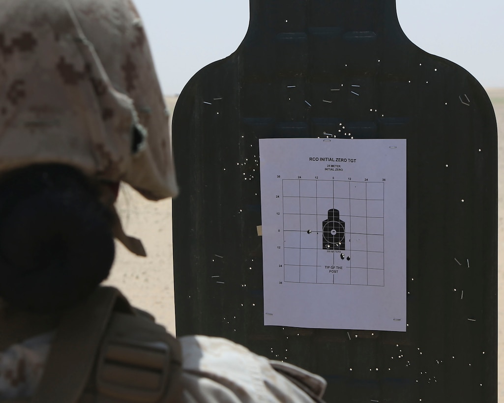 U.S. Marine Corps Sgt. Angelica Landin, a maintenance management chief with Marine Wing Support Squadron 372, Special Purpose Marine Air-Ground Task Force-Crisis Response-Central Command, examines her shot group on target during a battle sight zone range while deployed in the Middle East, April 23, 2017. The training was conducted to ensure SPMAGTF Marines are prepared to react and respond to a variety of scenarios that may occur across the USCENTCOM area of operations. SPMAGTF-CR-CC is a well-trained crisis response unit that has the ability to project combat power over vast distances using organic aviation, logistical, and ground combat assets. (U.S. Marine Corps photo by Lance Cpl. Joshua S. McAlpine)