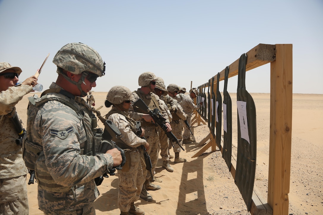 U.S. Marines with Marine Wing Support Squadron 372, Special Purpose Marine Air-Ground Task Force-Crisis Response-Central Command, and U.S. Airforce airmen attached to the 407th Air Expeditionary Group, check their targets at a battle sight zero range while forward deployed in the Middle East, April 23, 2017. The training was conducted to ensure SPMAGTF Marines are prepared to react and respond to a variety of scenarios that may occur across the USCENTCOM area of operations. SPMAGTF-CR-CC is a well-trained crisis response unit that has the ability to project combat power over vast distances using organic aviation, logistical, and ground combat assets. (U.S. Marine Corps photo by Lance Cpl. Joshua S. McAlpine)