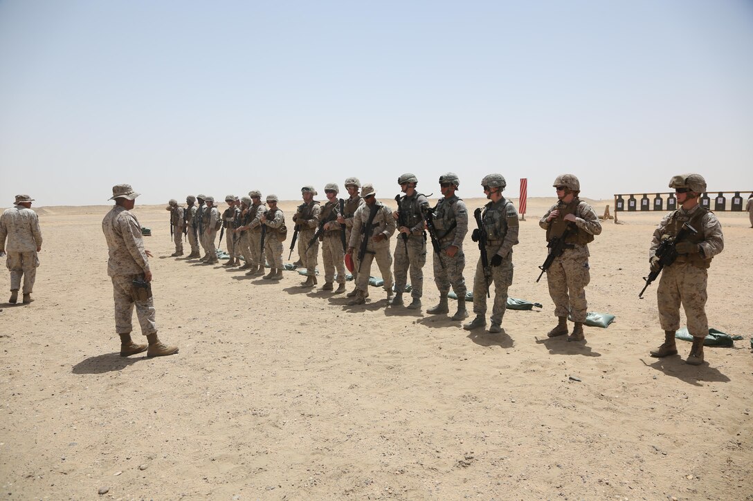 U.S. Marine Corps Master Sgt. Juan Espinosa, an expeditionary firefighting and rescue specialist with Marine Wing Support Squadron 372, Special Purpose Marine Air-Ground Task Force-Crisis Response-Central Command, briefs weapon safety procedures with Marines and airmen on a battle sight zero range while forward deployed in the Middle East, April 23, 2017. The training was conducted to ensure SPMAGTF Marines are prepared to react and respond to a variety of scenarios that may occur across the USCENTCOM area of operations. SPMAGTF-CR-CC is a well-trained crisis response unit that has the ability to project combat power over vast distances using organic aviation, logistical, and ground combat assets. (U.S. Marine Corps photo by Lance Cpl. Joshua S. McAlpine) 