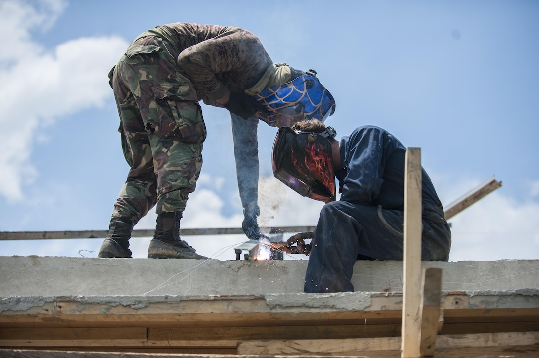 U.S. Marine Lance Cpl. Thomas Whitworth, right, and Philippine Army Pfc. Usabel Aljen weld a steel beam for a school classroom during Balikatan 2017 in Ormoc City, Leyte, April 23, 2017. Armed Forces of the Philippines along with U.S. military engineers worked together to build a new classroom at Don Carlos Elementary School in Ormoc City. Balikatan is an annual U.S.-Philippine military bilateral exercise focused on a variety of missions, including humanitarian assistance and disaster relief and counterterrorism. The increased interoperability will enhance readiness of humanitarian assistance and disaster relief capabilities. 