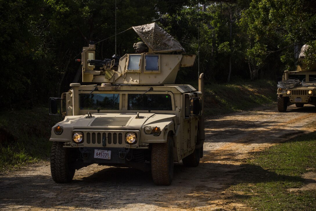 Marines conduct a mounted patrol at Central Training Area, Camp Hansen, Okinawa, Japan, April 18, 2017. 3d Law Enforcement Battalion conducted a Marine Corps Combat Readiness Evaluation to test each company’s ability to execute tasks ranging from policing operations to police patrolling, route regulations, key leader engagements in towns and local population centers, security of key infrastructure, identity operations and law enforcement operations in an expeditionary environment to ensure they are prepared to support the operational requirements of III Marine Expeditionary Force. The Marines are with Charlie Company, 3d LE Bn, III MEF Force Headquarters Group. (U.S. Marine Corps photo by Lance Cpl. Joshua Pinkney)