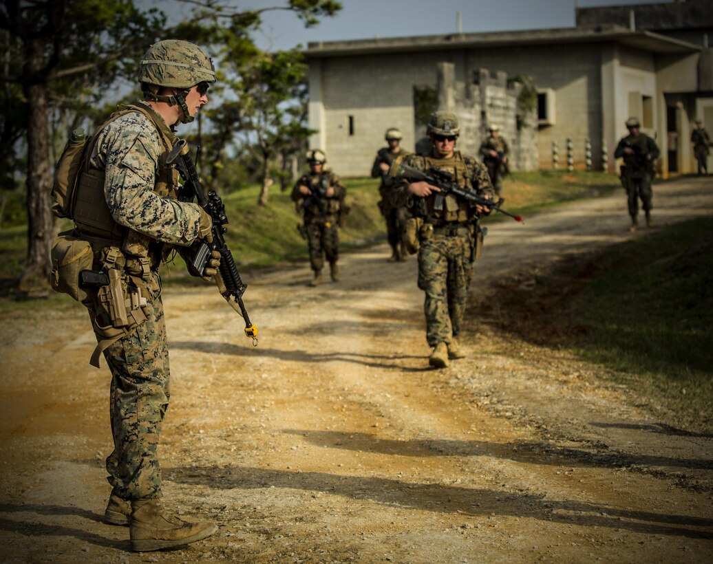Marines conduct a dismounted patrol at Central Training Area, Camp Hansen, Okinawa, Japan, April 19, 2017. 3d Law Enforcement battalion conducted a Marine Corps Combat Readiness Evaluation to test each company’s ability to execute tasks ranging from policing operations to police patrolling, route regulations, key leader engagements in towns and local population centers, security of key infrastructure, identity operations and law enforcement operations in an expeditionary environment to ensure they are prepared to support the operational requirements of III Marine Expeditionary Force. The Marines are with Charlie Company, 3d LE Bn, III MEF Headquarters Group. (U.S. Marine Corps photo by Lance Cpl. Joshua Pinkney)