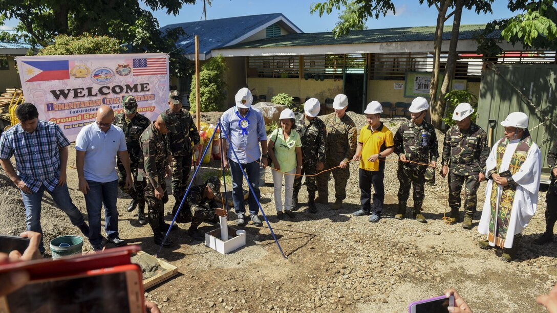 Leaders from the Armed Forces of the Philippines, U.S. military, and Ormoc City bury a time capsule to commemorate the beginning of engineering projects for new classrooms during Balikatan 2017 at Don Carlos Elementary School in Ormoc City, Leyte, April 25, 2017. Balikatan is an annual U.S.-Philippine military bilateral exercise focused on a variety of missions, including humanitarian assistance and disaster relief and counterterrorism. 
