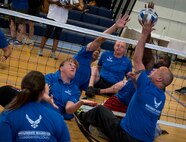 Air Force Warrior CARE athletes compete in a sitting volleyball scrimmage game during the last day of the adaptive sports camp at Eglin Air Force Base, Fla., April 28. The base hosts the week-long Wound Warrior CARE event that helps recovering wounded, ill and injured military members through specific hand-on rehabilitative training. (U.S. Air Force photo/Samuel King Jr.)