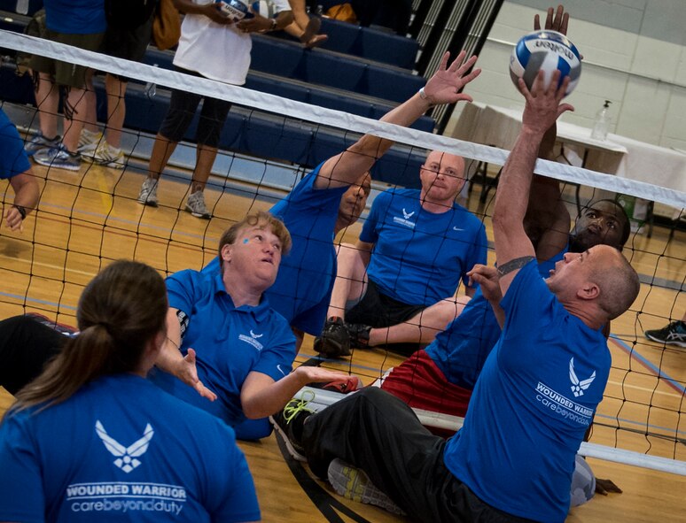 Air Force Warrior CARE athletes compete in a sitting volleyball scrimmage game during the last day of the adaptive sports camp at Eglin Air Force Base, Fla., April 28. The base hosts the week-long Wound Warrior CARE event that helps recovering wounded, ill and injured military members through specific hand-on rehabilitative training. (U.S. Air Force photo/Samuel King Jr.)