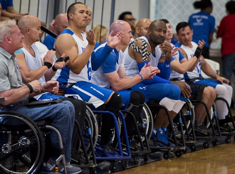 The Air Force Warrior Games wheelchair basketball team members cheer on their players during a scrimmage game on the final day of a training camp held at Eglin Air Force Base, Fla., April 28. The base-hosted, week-long Warrior Games training camp is the last team practice session before the yearly competition in June. (U.S. Air Force photo/Samuel King Jr.)