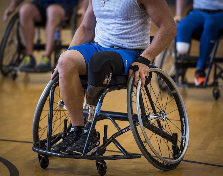 The Air Force Warrior Games wheelchair basketball player moves into position during a scrimmage game on the final day of a training camp held at Eglin Air Force Base, Fla., April 28. The base-hosted, week-long Warrior Games training camp is the last team practice session before the yearly competition in June. (U.S. Air Force photo/Samuel King Jr.)