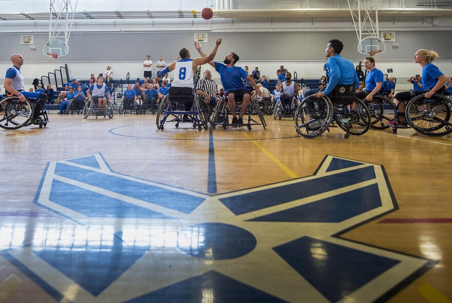 A scrimmage game begins between the Air Force Warrior Games team and a Warrior CARE team on the final day of both groups’ training camps held at Eglin Air Force Base, Fla., April 28. The base-hosted, week-long Warrior Games training camp is the last team practice session before the yearly competition in June. (U.S. Air Force photo/Samuel King Jr.)