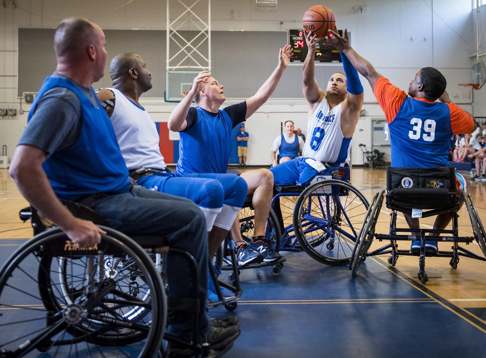 Brian Williams, an Air Force Warrior Games wheelchair basketball player, tries to hold onto the ball during a scrimmage game against base leadership on the final day of a training camp held at Eglin Air Force Base, Fla., April 28. The base-hosted, week-long Warrior Games training camp is the last team practice session before the yearly competition in June. (U.S. Air Force photo/Samuel King Jr.)
