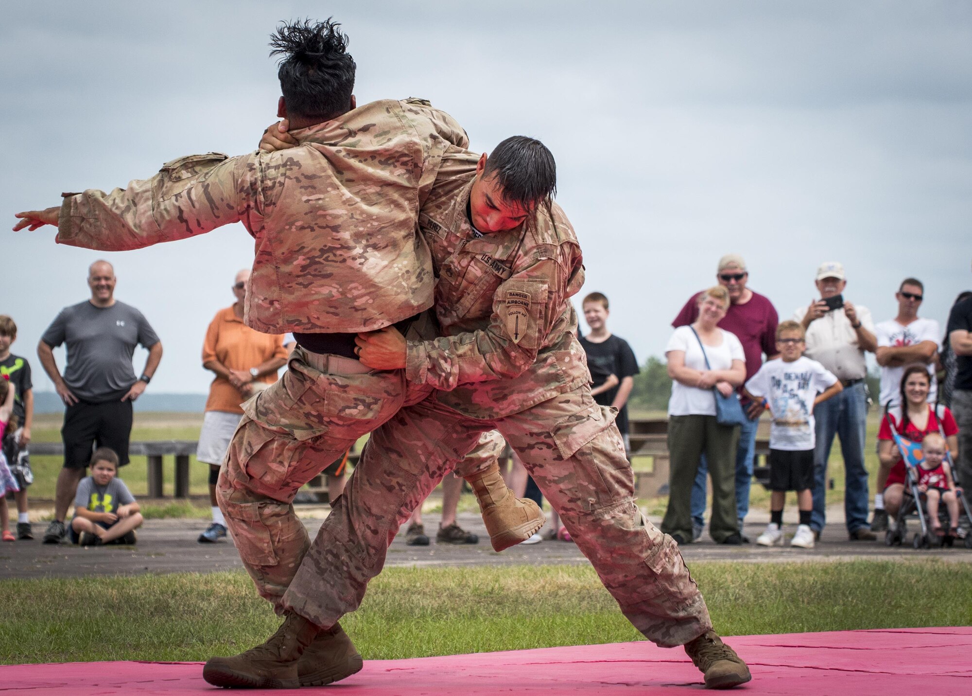 Soldiers demonstrate hand-to-hand combat during the 6th Ranger Training Battalion’s open house event April 29 at Eglin Air Force Base, Fla. The event was a chance for the public to learn how Rangers train and operate. The event displays showed equipment, weapons, a reptile zoo, face painting and weapon firing among others. The demonstrations showed off hand-to-hand combat, a parachute jump, snake show, and Rangers in action. (U.S. Air Force photo/Samuel King Jr.)