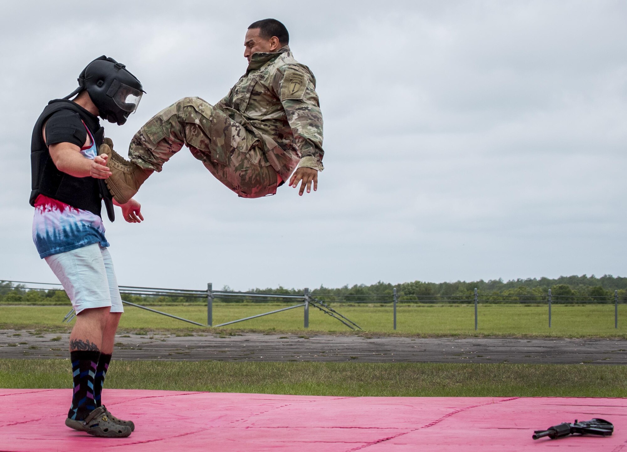 A Soldier demonstrates hand-to-hand combat on a “volunteer” from the crowd during the 6th Ranger Training Battalion’s open house event April 29 at Eglin Air Force Base, Fla. The event was a chance for the public to learn how Rangers train and operate. The event displays showed equipment, weapons, a reptile zoo, face painting and weapon firing among others. The demonstrations showed off hand-to-hand combat, a parachute jump, snake show, and Rangers in action. (U.S. Air Force photo/Samuel King Jr.)