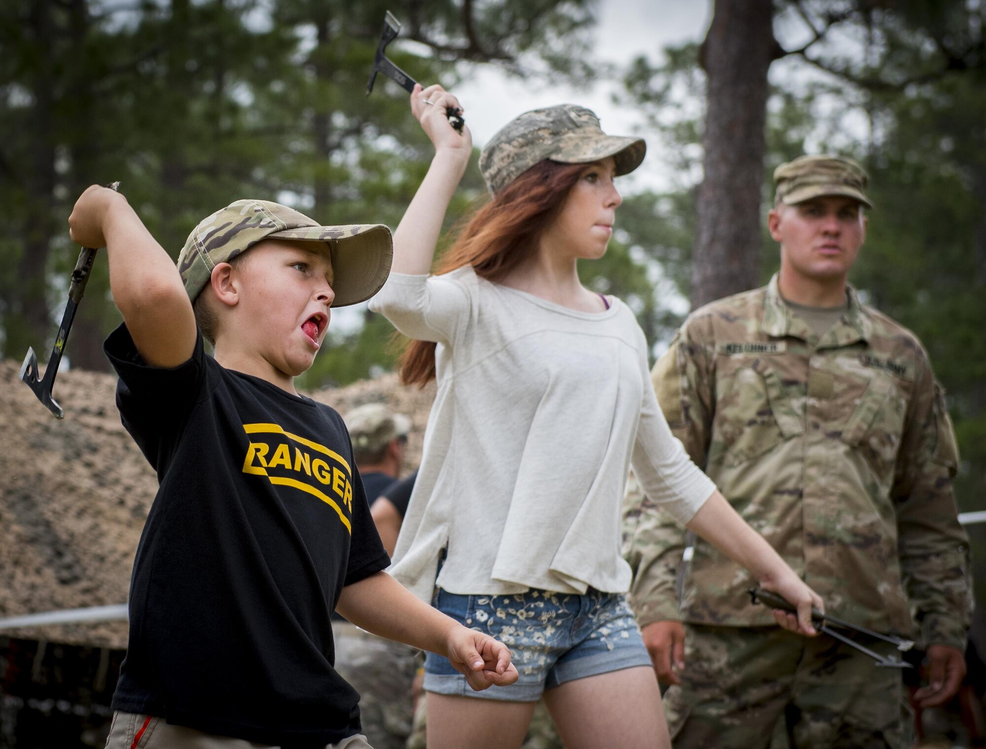 Future Soldiers throw tomahawks at targets during the 6th Ranger Training Battalion’s open house event April 29 at Eglin Air Force Base, Fla. The event was a chance for the public to learn how Rangers train and operate. The event displays showed equipment, weapons, a reptile zoo, face painting and weapon firing among others. The demonstrations showed off hand-to-hand combat, a parachute jump, snake show, and Rangers in action. (U.S. Air Force photo/Samuel King Jr.)