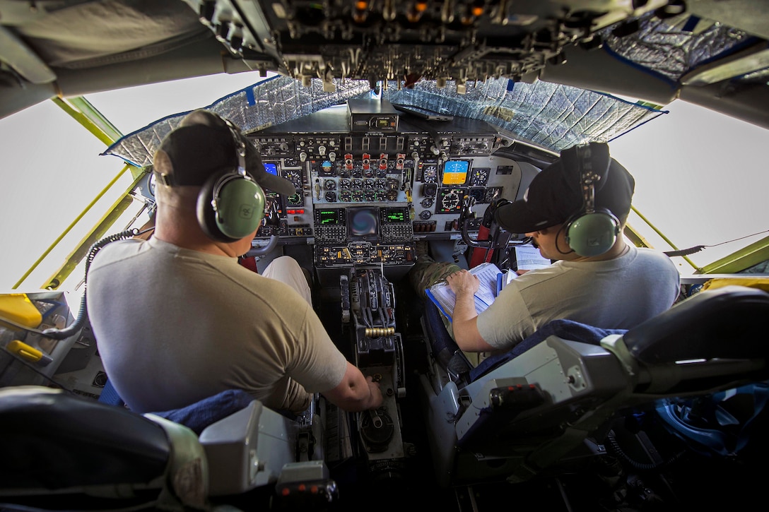 Two KC-135 Stratotanker pilots assigned to the 340th Expeditionary Air Refueling Squadron prepare to take off from Al Udeid Air Base, Qatar, April 21, 2017. The 340th EARS is responsible for delivering fuel for U.S. and coalition forces. Air Force photo by Senior Airman Trevor T. McBride