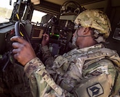 Sgt. John Akins, Florida National Guard 3rd Battalion, 265 Air Defense Artillery Regiment, uses a touchscreen from the driver’s seat of an Army Avenger April 20.  The unit along with the Army’s Stinger Based Systems used the Eglin Air Force Base range to test fire stinger missiles from the vehicle. (U.S. Air Force photo/Samuel King Jr.)