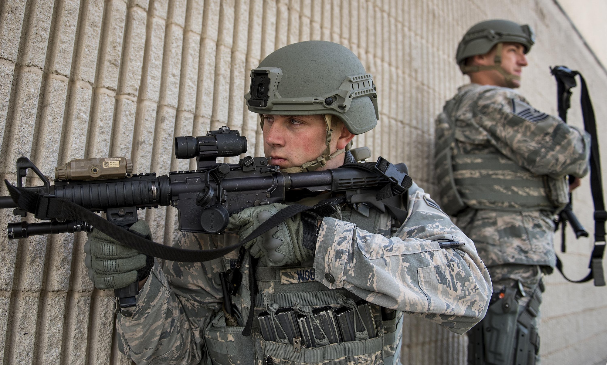 Airman 1st Class Marcus Wolford, 96th Security Forces Squadron, watches the building’s entrance during an active shooter exercise at Eglin Air Force Base, Fla., April 11.  The goal of the exercise was to evaluate people’s knowledge and response at the active shooter location and select lockdown locations.  (U.S. Air Force photo/Samuel King Jr.)