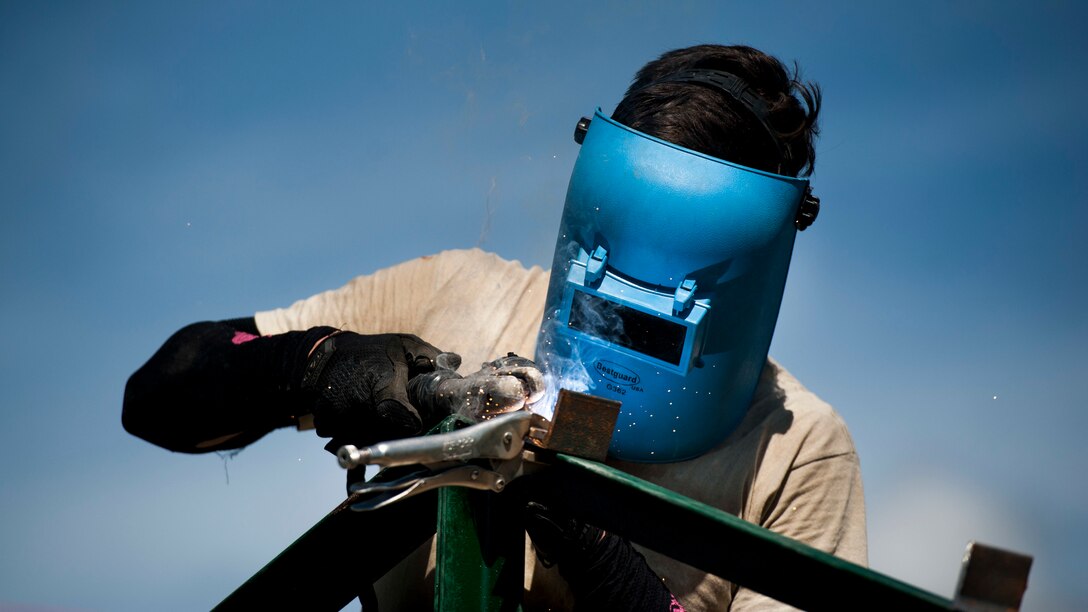 U.S. Air Force Airman 1st Class Adrian Wance welds brackets to roof-support beams during Balikatan 2017 in Ormoc City, Leyte, April 27, 2017. Wance and other U.S. military engineers worked together with Philippine Soldiers to build new classrooms at Margen Elementary School in Ormoc City. Balikatan is an annual U.S.-Philippine military bilateral exercise focused on a variety of missions, including humanitarian assistance and disaster relief, counterterrorism, and other combined military operations. 