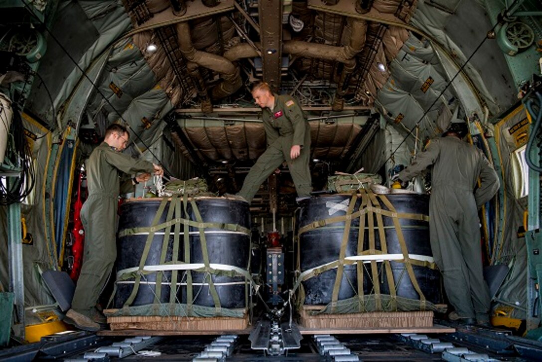 C-130H Hercules loadmasters with the 36th Airlift Squadron prepare container delivery system bundles during a mass drop training exercise April 12, 2017, at Yokota Air Base, Japan. The training exercise was also Col. Neil R. Richardson’s, 374th Airlift Wing vice commanders, “fini” flight. (U.S. Air Force photo by Airman 1st Class Donald Hudson)