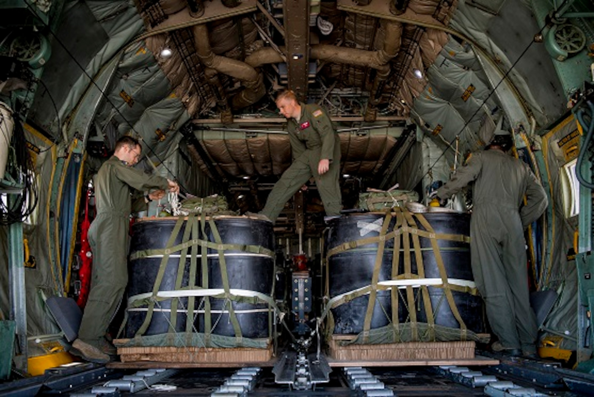 C-130H Hercules loadmasters with the 36th Airlift Squadron prepare container delivery system bundles during a mass drop training exercise April 12, 2017, at Yokota Air Base, Japan. The training exercise was also Col. Neil R. Richardson’s, 374th Airlift Wing vice commanders, “fini” flight. (U.S. Air Force photo by Airman 1st Class Donald Hudson)