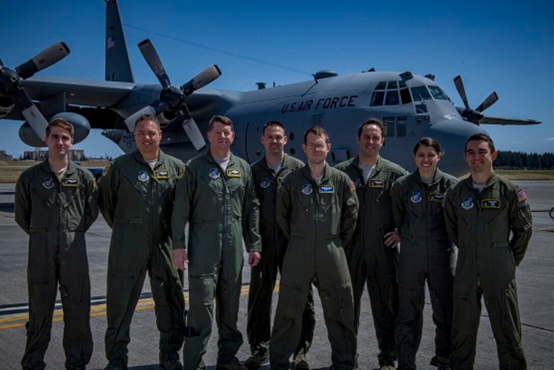 Aircrew members pose for a photo before Col. Neil R. Richardson, 374th Airlift Wing vice commanders, “fini” flight April 12, 2017, at Yokota Air Base, Japan. Richardson’s last flight, known as a “fini” flight, follows an Air Force tradition dating back to WWII where upon completion of an aircrew member’s final flight they are doused with water and congratulated by their comrades in arms and family. (U.S. Air Force photo by Airman 1st Class Donald Hudson)