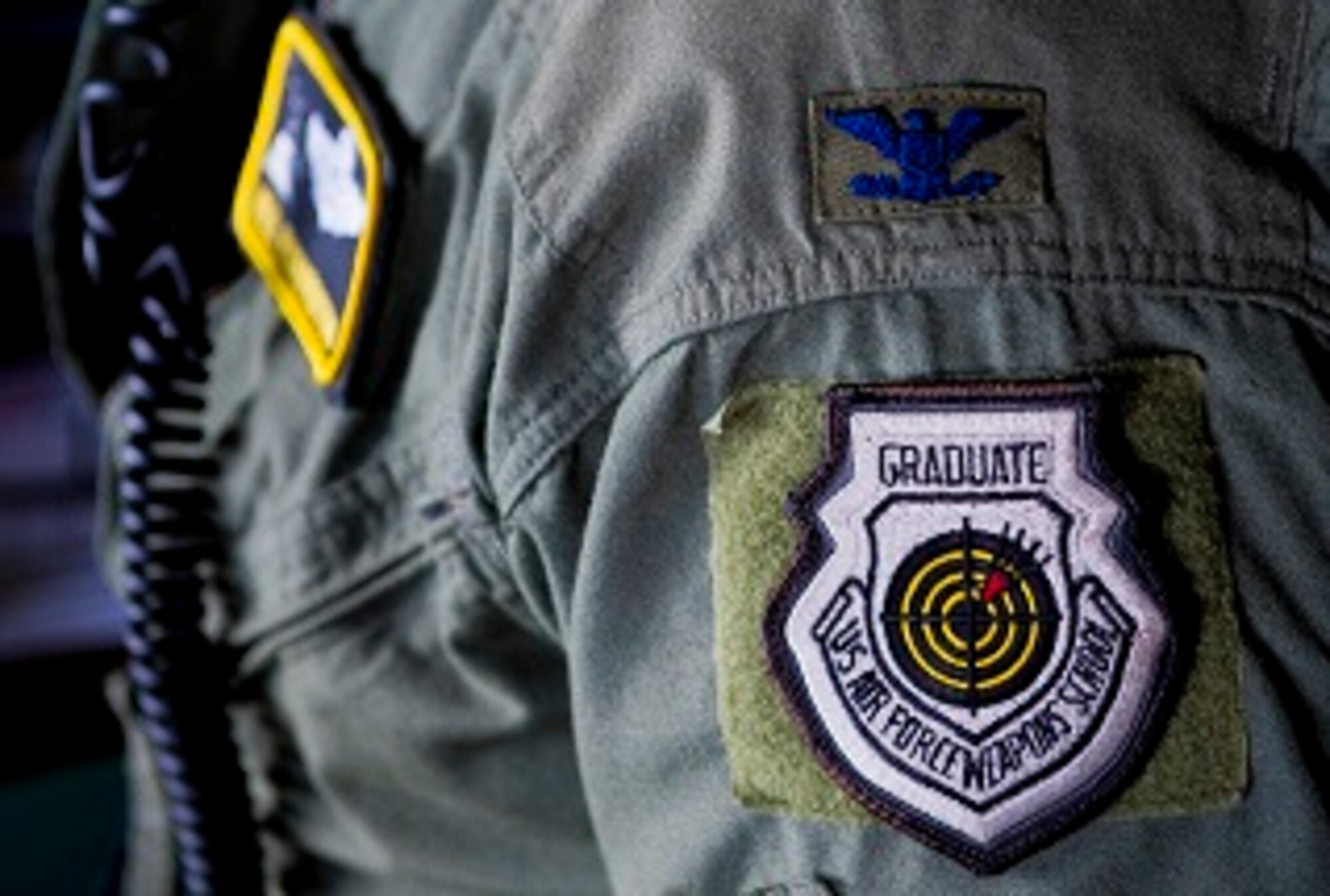 Rank and U.S. Air Force Weapons School Graduate badge of Col. Neil R. Richardson, 374th Airlift Wing vice commander, April 12, 2017, over mainland Japan. Richardson is a C-130E/H Hercules master navigator and former U.S. Air Force Weapons Instructor Cadre. (U.S. Air Force photo by Airman 1st Class Donald Hudson)