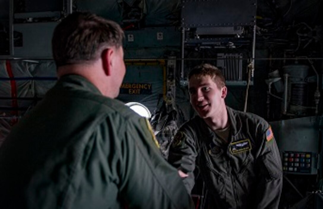 Col. Neil R. Richardson, 374th Airlift Wing vice commander, shakes hands with Airman 1st Class Christian Williams, 36th Airlift Squadron C-130H Hercules loadmaster, after completion of Richardson’s “fini” flight April 12, 2017, at Yokota Air Base, Japan. After the flight Richardson shook hands and thanked the Aircrew, and during his speech thanked everyone who worked to accomplish his “fini” flight. (U.S. Air Force photo by Airman 1st Class Donald Hudson)