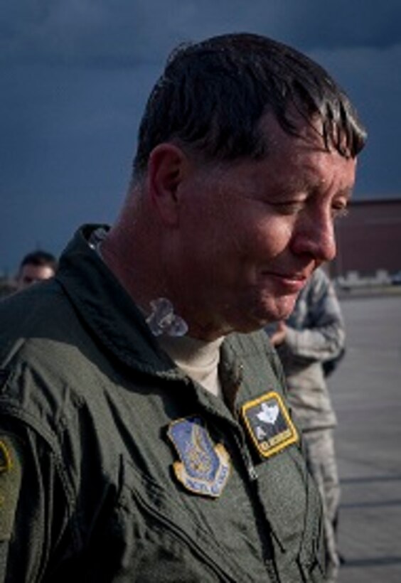 Col. Neil R. Richardson, 374th Airlift Wing vice commander, smiles after his family sprayed him with water after his “fini” flight April 12, 2017, at Yokota Air Base, Japan. Richardson’s last flight, known as a “fini” flight, follows an Air Force tradition dating back to WWII where upon completion of an aircrew member’s final flight they are doused with water and congratulated by their comrades in arms and family. (U.S. Air Force photo by Airman 1st Class Donald Hudson)