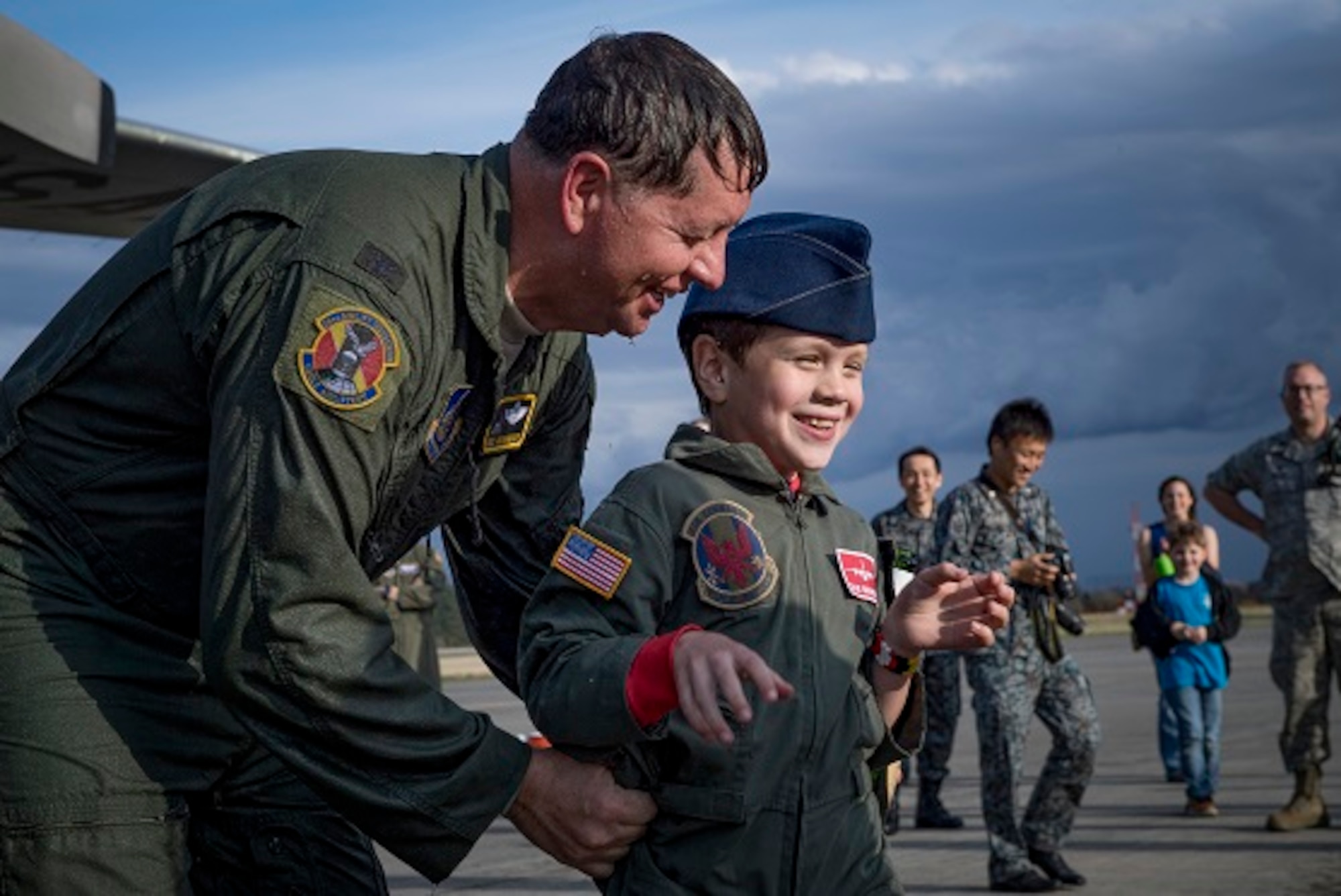 Col. Neil R. Richardson, 374th Airlift Wing vice commander, laughs with his son Gage after his “fini” flight, April 12, 2017, at Yokota Air Base, Japan. Richardson is scheduled to leave Yokota to become commander of the 87th Air Base Wing at Joint Base McGuire-Dix-Lakehurst. (U.S. Air Force photo by Airman 1st Class Donald Hudson)